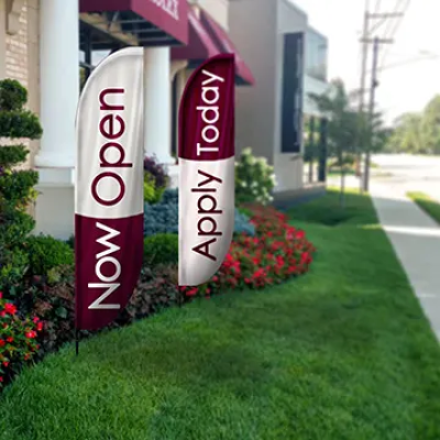 Feather flags strategically placed to maximize brand visibility at an outdoor event.